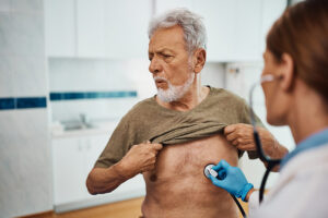 An elderly man undergoing lung checkup